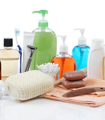 assorted personal hygiene products on white background